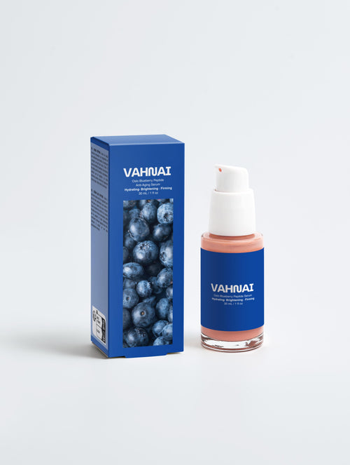VAHNAI skincare product with blue packaging and blueberries on a white background