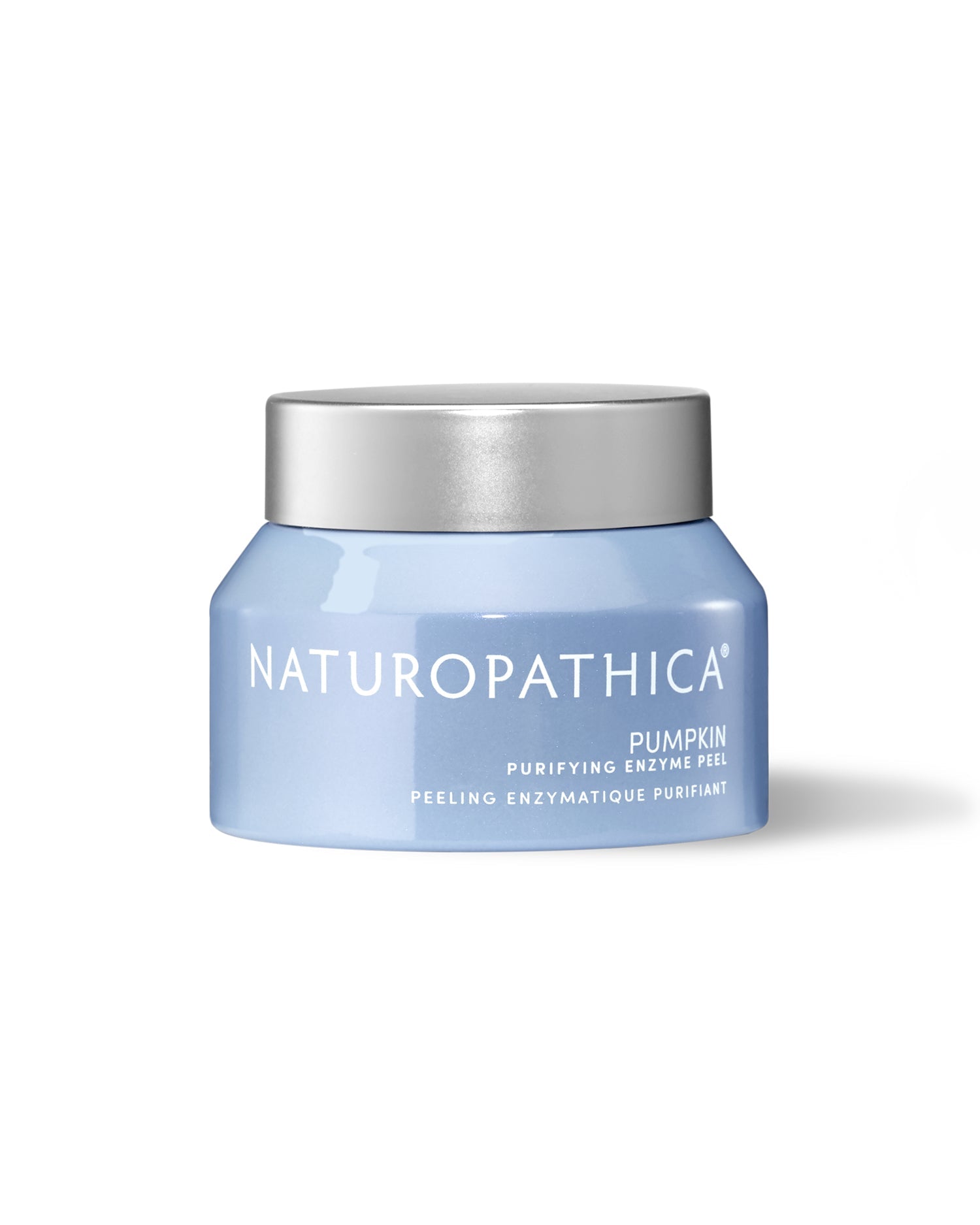 Naturopathica pumpkin facial product jar surrounded by pumpkins