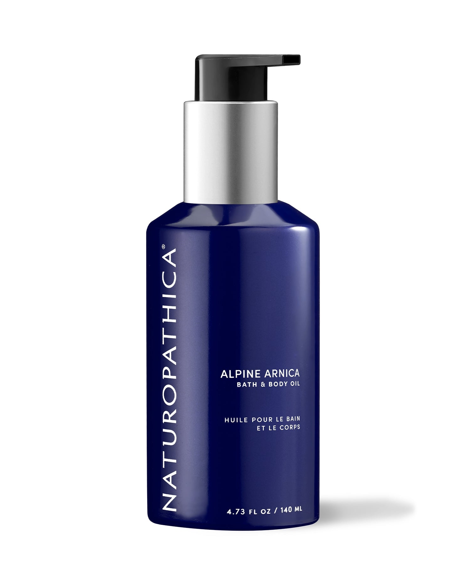 Glass bottle of Naturopathica Alpine Arnica Bath & Body Oil on a stone tray with herbal accents, styled for post-workout recovery or body care