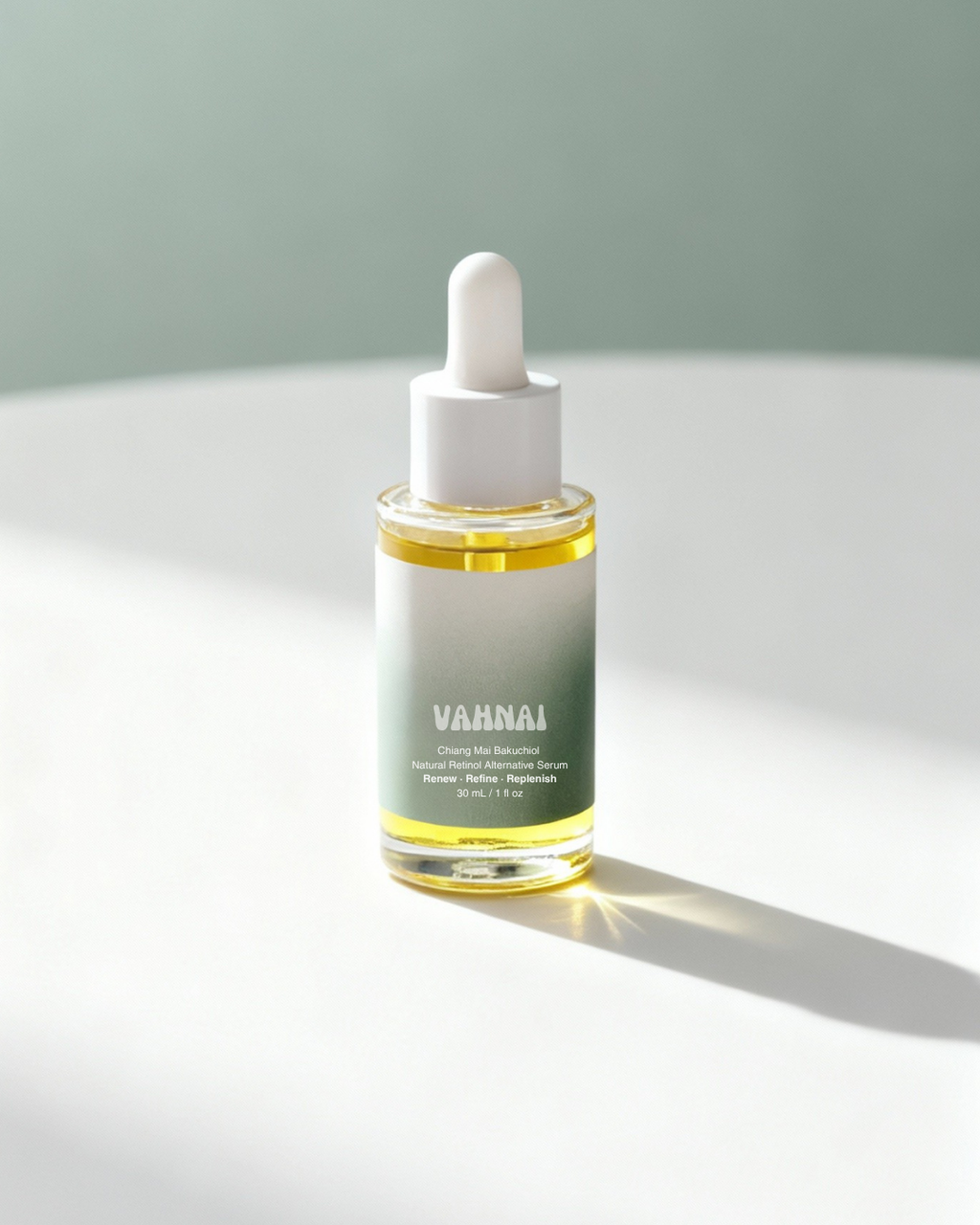 Close-up of pure bakuchiol extract beside VAHNAI serum bottle highlighting natural retinol alternative