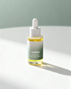 Close-up of pure bakuchiol extract beside VAHNAI serum bottle highlighting natural retinol alternative