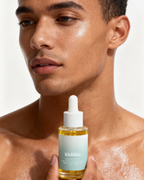 Male model applying VAHNAI Chiang Mai Bakuchiol Serum with clean modern aesthetic
