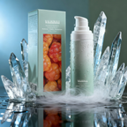 Lifestyle image of VAHNAI Cloudberry Hydrating Serum on marble surface with soft light reflections, representing clean beauty.
